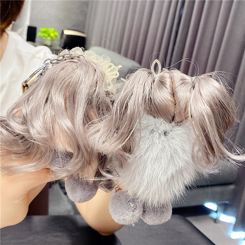 Varëse çelësash me vajzë me syze