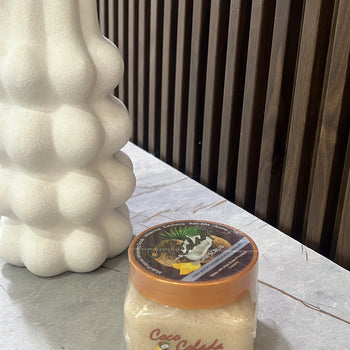 Scrub me arrë kokosi “Shea Sugar Scrub”
