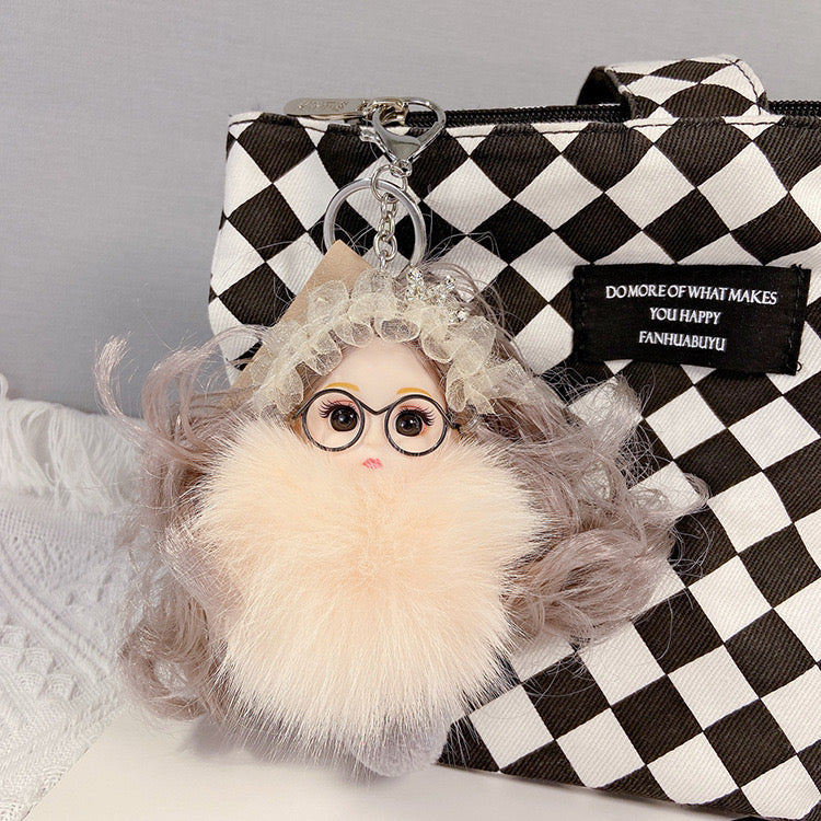 Varëse çelësash me vajzë me syze