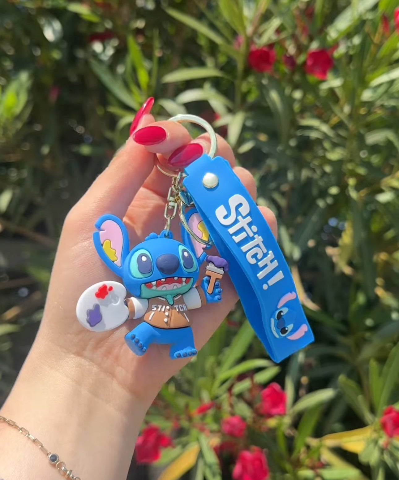 Varëse çelsash silikoni me Stitch me kitare, serfi, mottor, kufje etjl