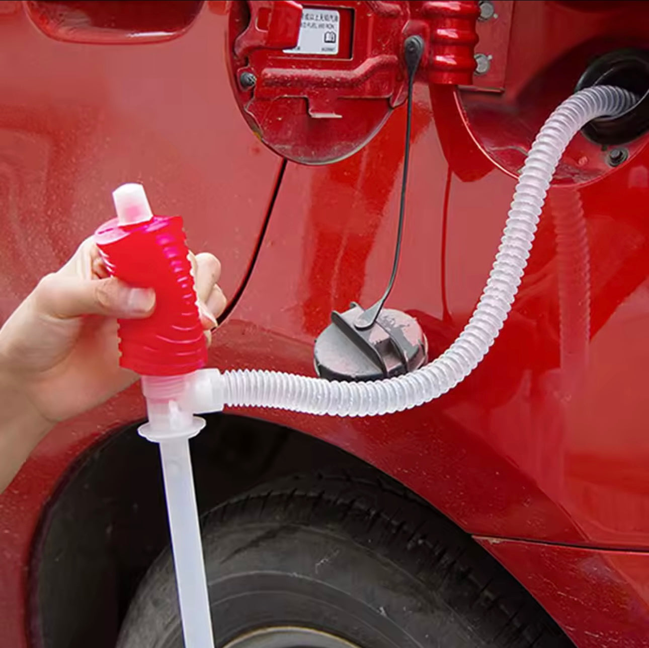 Pompë manuale lëngjesh, plastikë në ngjyrë kuqe dhe transparente