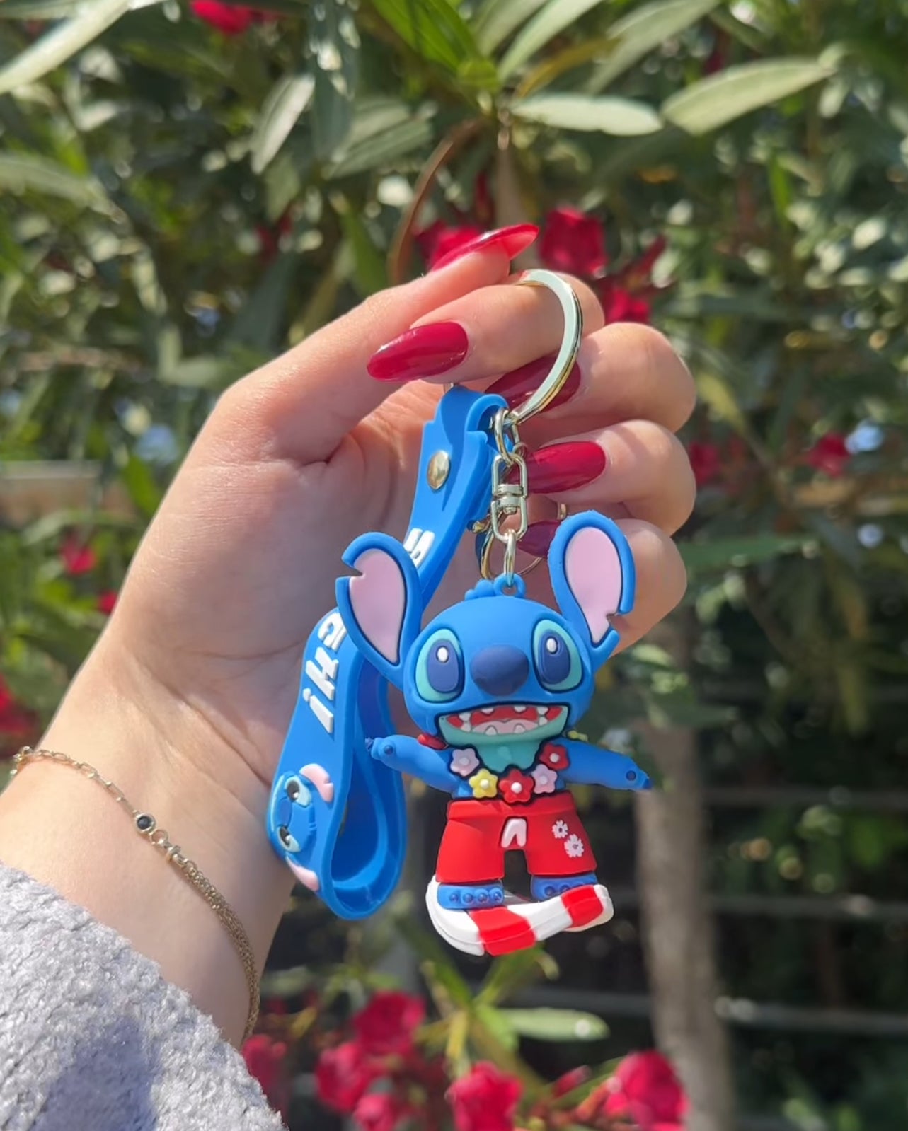 Varëse çelsash silikoni me Stitch me kitare, serfi, mottor, kufje etjl