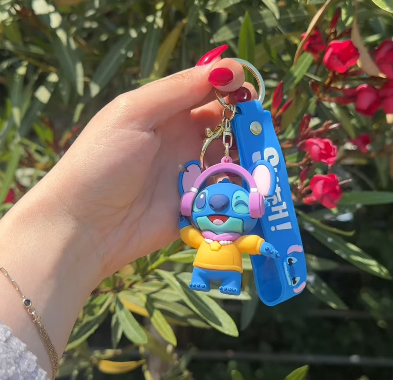 Varëse çelsash silikoni me Stitch me kitare, serfi, mottor, kufje etjl