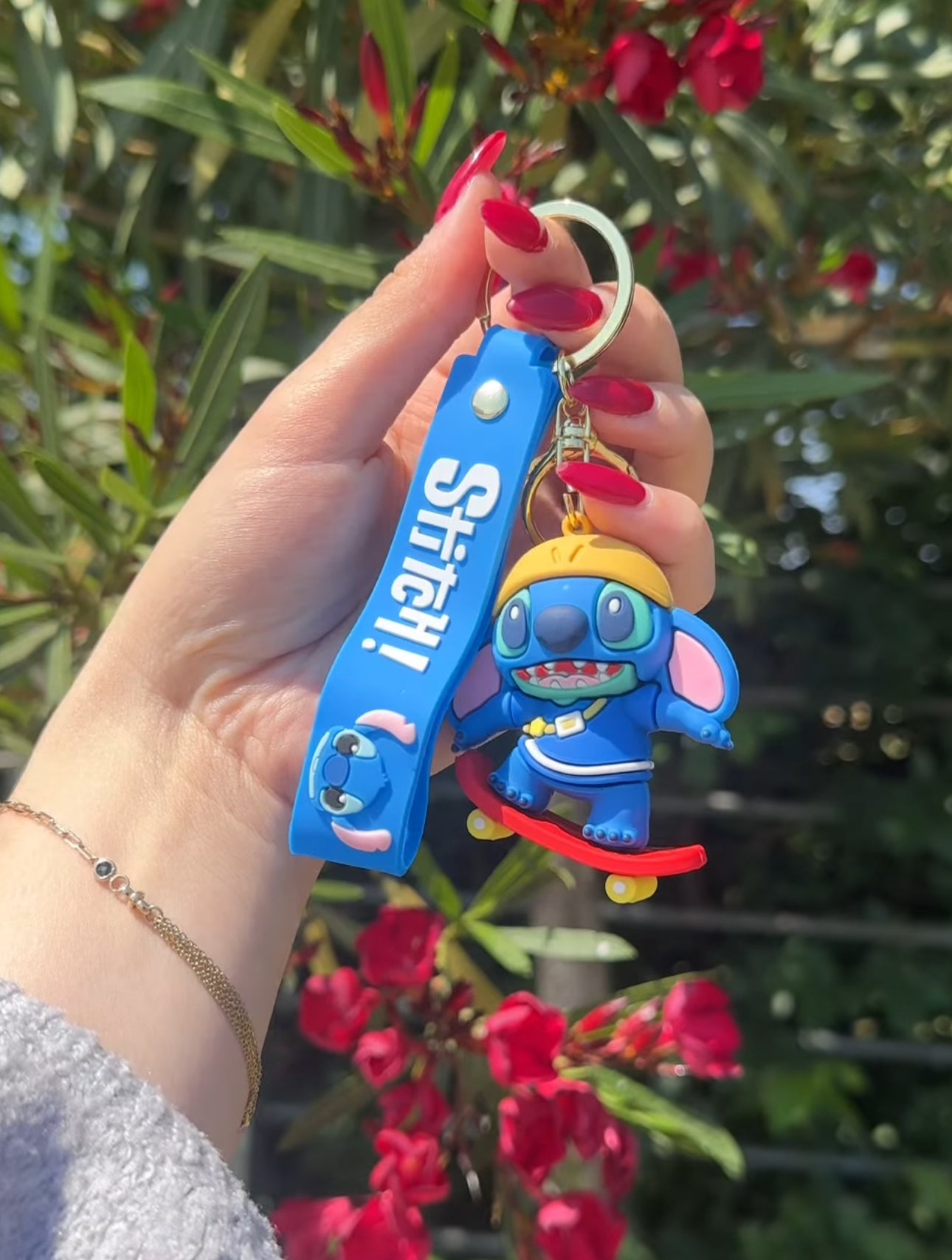 Varëse çelsash silikoni me Stitch me kitare, serfi, mottor, kufje etjl