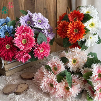 Tufë me gerbera artificiale 12 koka