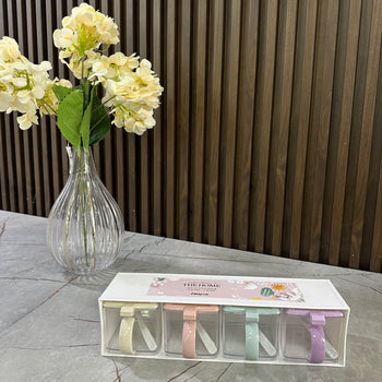 Set kutish për erëza me lugë dhe kapakë pastel (4 copë)