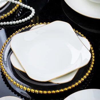 Pjatë porcelani me kontur gold dhe cepa rrethore
