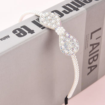 Rreth flokësh me fjongo me perla