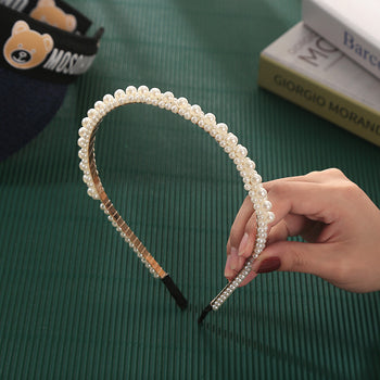 Rreth flokësh me perla