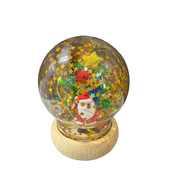 Glob dekorativ me Babagjysh, zbukurim festiv me shkëlqim yjesh