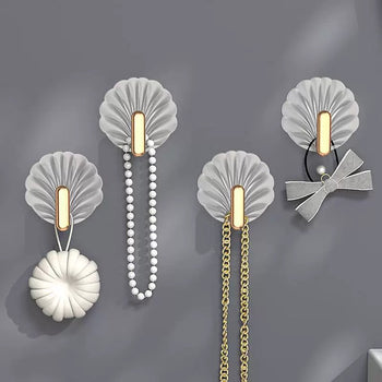 Kapëse murale dekorative me dizajn guaskë