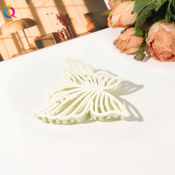 Kapëse flokësh në formë fluture në ngjyra pastel