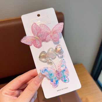 Set me 3 kapëse me flutura dhe zemra me reflekse perle