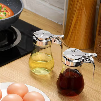 Shishe qelqi për vaj me kapak metalik