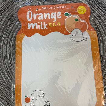Tabelë me lapustilë për shkrim “Orange Milk”