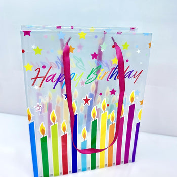 Çantë paketimi transparente "Happy birthday" me qirinj dhe yje