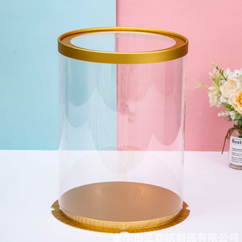 Kuti transparente rrethore për torta ose lule e dhurata me bazament në ngjyrën gold e transparent