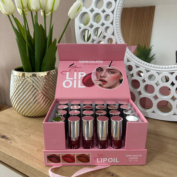 Lip oil për buzë me efekt hidrat