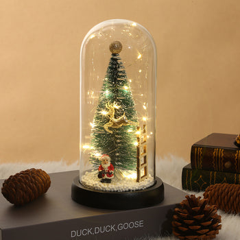 Kupolë qelqi me drita e borë artificiale me pemë, shkallë e drer