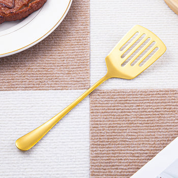 Spatul për servirje me kullim prej inoksi në ngjyrën gold