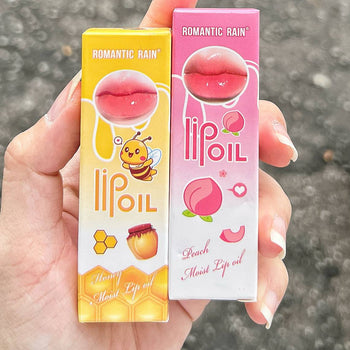 Lip oil me pjeshkë ose mjaltë Romantic Rain